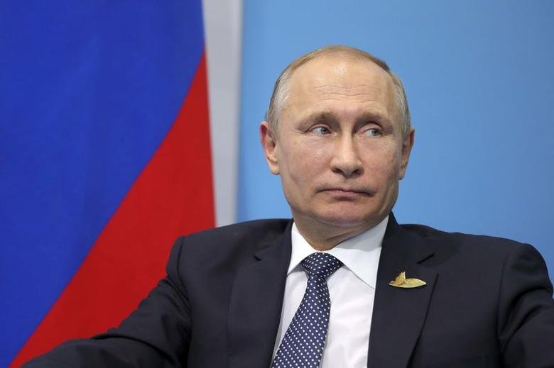 Vladimit Putin signs law that could keep him in Kremlin until 2036