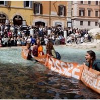 Rome climate protest turns Trevi Fountain black.